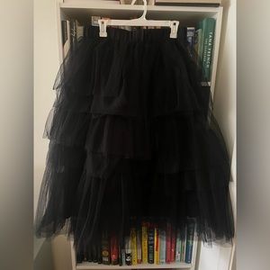 Black tulle skirt, fluffy, lined underneath, elastic waist, no zipper. UNWORN